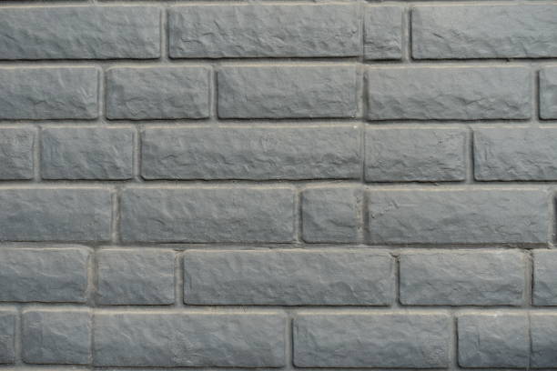 istock Close shot of dusty black painted brick veneer wall 1430298528