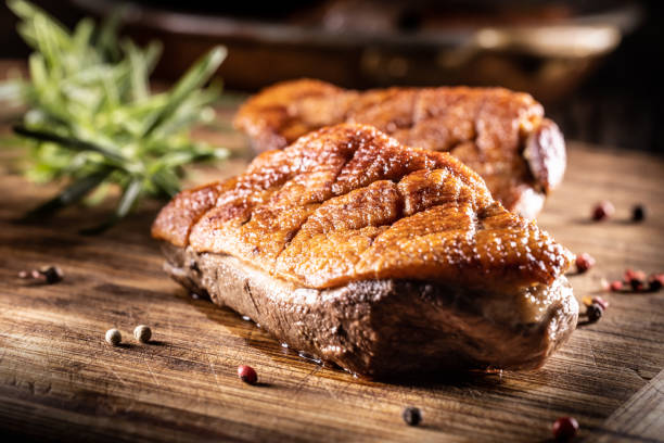 istock Roasted duck breast on a cutting board ready for slicing and serving. 1430299898