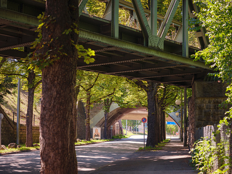 the old metal bridge over the street in park in Basel city Switzerland