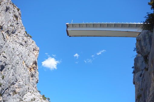 Unfinished bridge over the abyss . Observation deck in the mountains