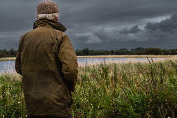 istock Rear view of a mature man looking at a river 1430318839