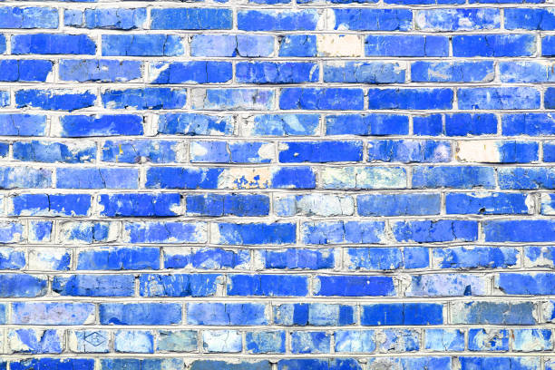 istock Brick wall with unusual blue bricks made of whole blue bricks and broken blue bricks 1430319164
