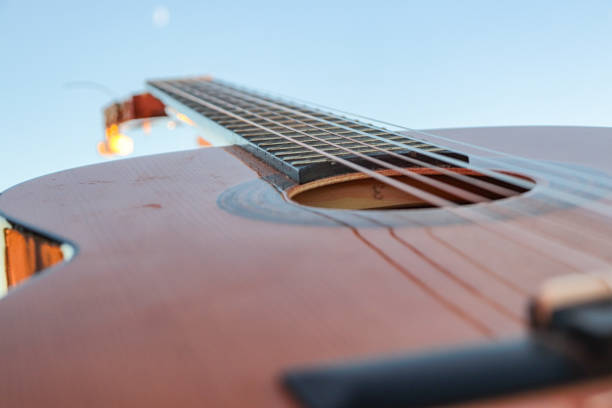 classical guitar close-up with the sea in the background