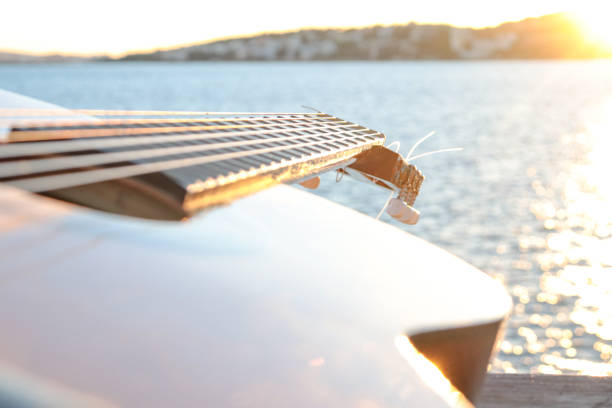 classical guitar close-up with the sea in the background