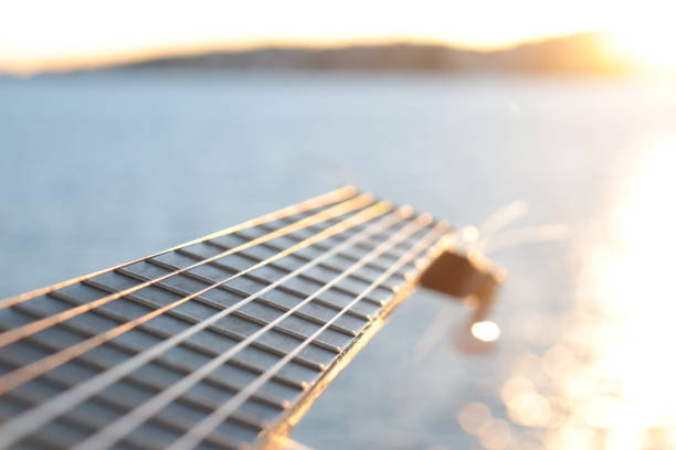 istock classical guitar close-up with the sea in the background 1430329713