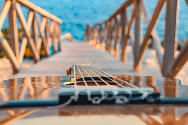istock classical guitar close-up with the sea in the background 1430329773