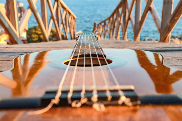 istock classical guitar close-up with the sea in the background 1430329796