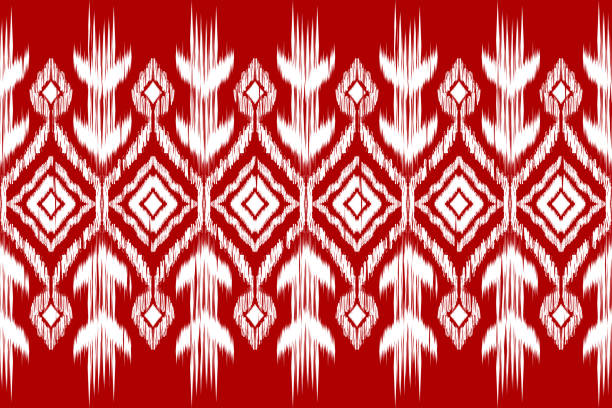 African Ikat paisley seamless pattern African Ikat paisley embroidery.red and white background.geometric ethnic oriental seamless pattern traditional.Aztec style abstract vector illustration.design for texture,fabric,clothing,wrapping, christmas batik fabric stock illustrations