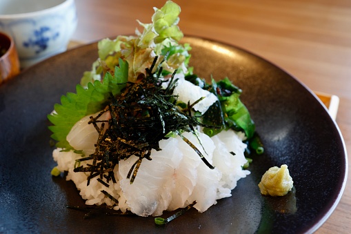 Local cuisine of Uwajima City, Ehime Prefecture. Raw sea bream on a bed of rice. Tai-meshi.
