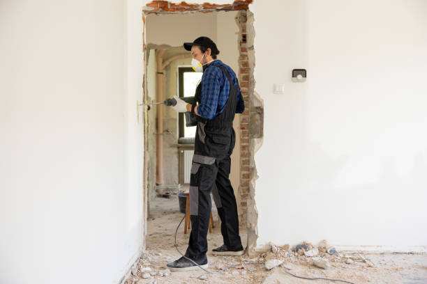 istock Worker man drilling in concrete on a construction site 1430333805