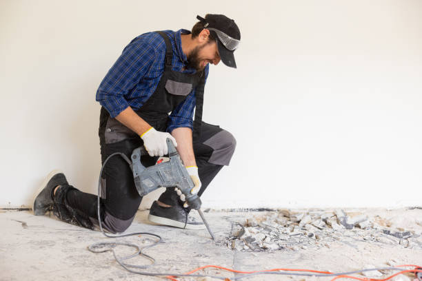istock View of a construction worker using a hand-held demolition hammer and breaker to demolish walls to remove old floor tiles during renovation work 1430334328