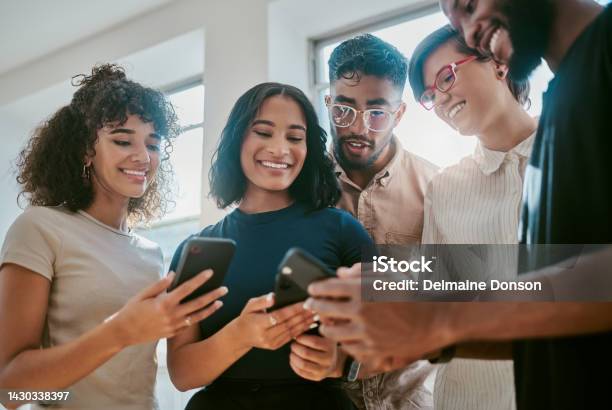 Networking Teamwork And Phone Collaboration With Digital Team Working On Brand And App Logo In An Office Startup Vision And Diversity With Partner Coworkers Planning Success With Online Project Stock Photo - Download Image Now