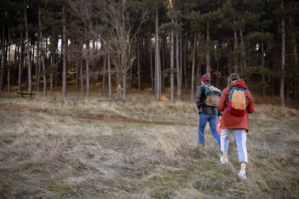 istock Young couple walking in a forest 1430342361