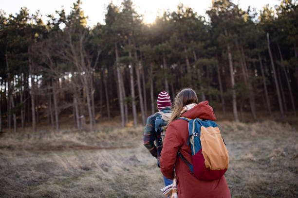 istock Young couple walking in a forest 1430343007