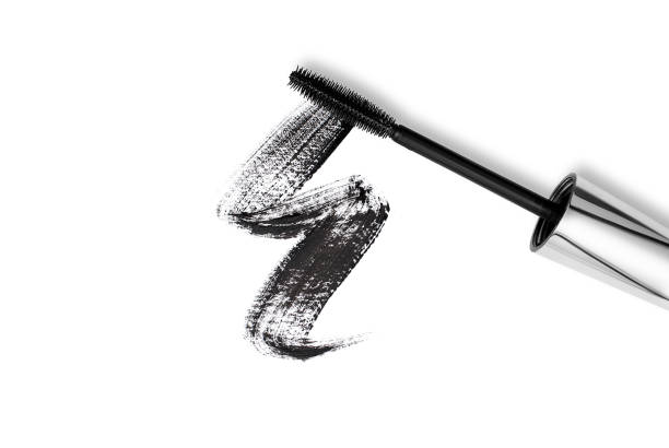 istock Black mascara brush stroke with applicator brush isolated on white 1430343231