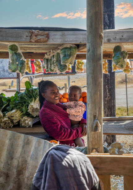 istock African woman selling veggies 1430344435