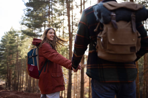 istock Young couple walking together on a forest hiking trip 1430345068