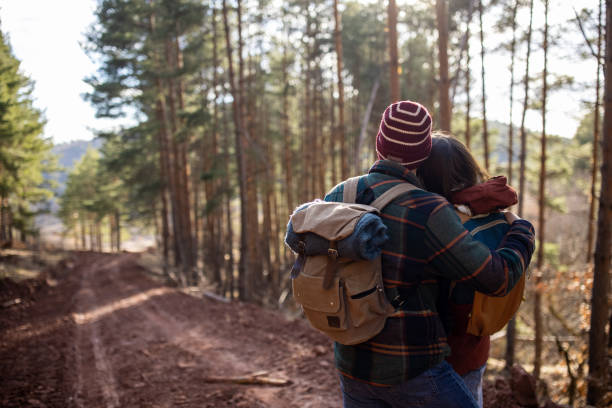 istock Young couple taking a selfie while on a forest hiking trip 1430345976