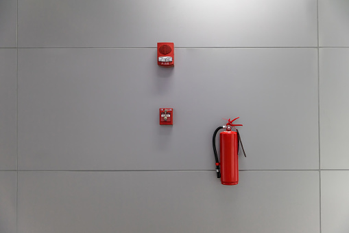 Fire extinguisher on the wall Fire extinguishing system inside the building.