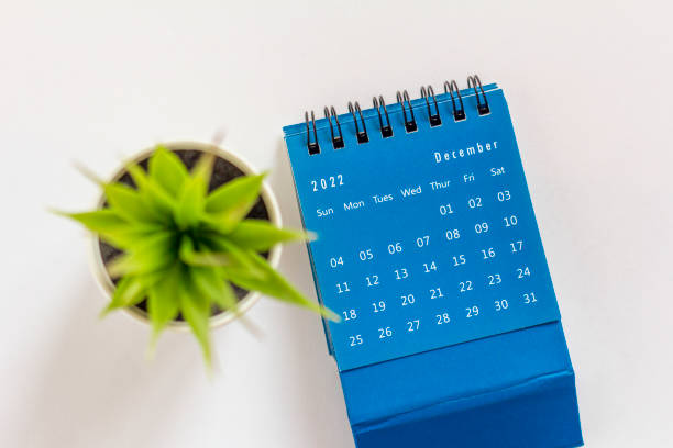 istock Hello, December.Desktop calendar for December 2022 on a light background. 1430346826