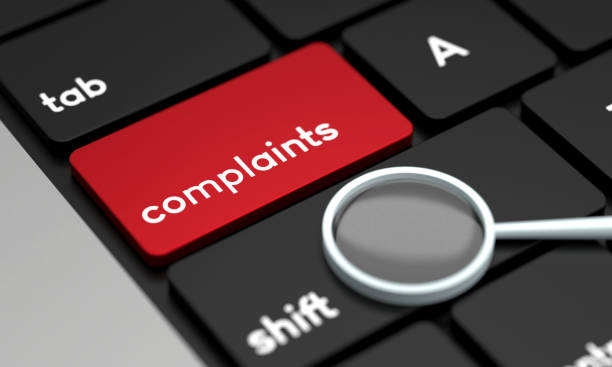 istock Close-Up Laptop Keyboard With Complaints Button and magnifying glass 1430349593