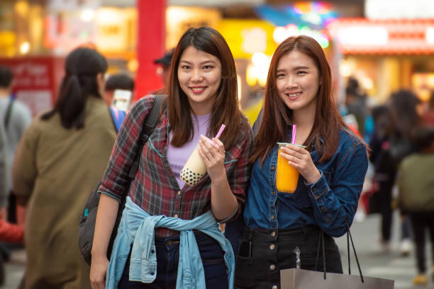 istock Two joyful Asian women enjoy bubble milk tea together 1430352294