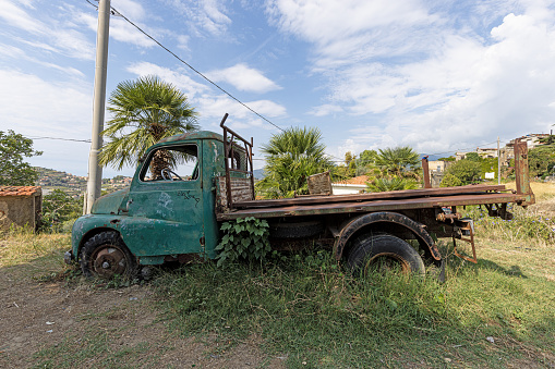 Picture of a weathered and unusable transporter in a field