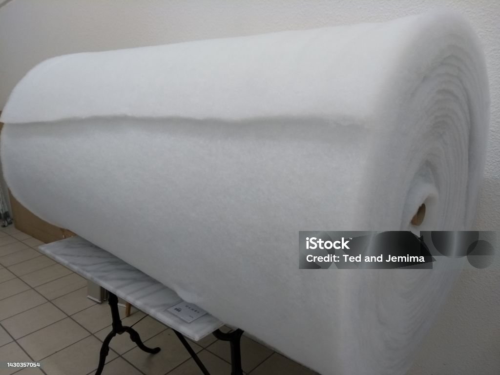 Enormous Roll Of White Felt Fabric On Stand Stock Photo - Download