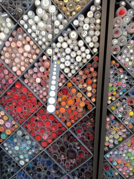 istock Display of different colour and size buttons in plastic tubes 1430357095