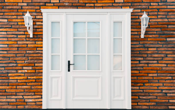 istock White closed modern door with brick wall 1430357854