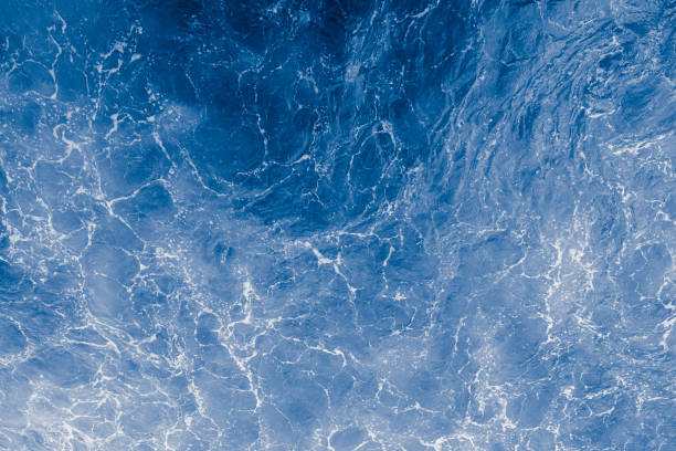 istock Blue purple sea surface with waves, splash and bubbles 1430358126