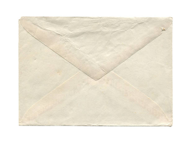 alter vintage-gealterter geschlossener papierumschlag isoliert auf weiß - old envelope stock-fotos und bilder