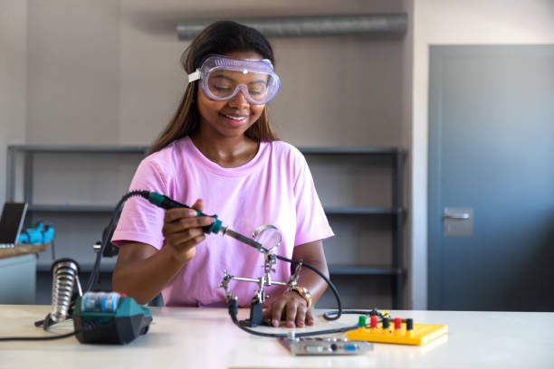 istock Teenager black girl high school student in class learning electronics. Copy space.Education 1430368218