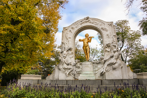 Famous Johann Strauss monument in Stadtpark in Vienna, Austria made by Edmund Hellmer in 1921. The statue is made from bronze and gold.