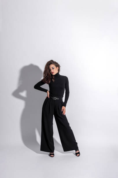 istock Woman with black outfit studio portrait on white background with copy space 1430369847