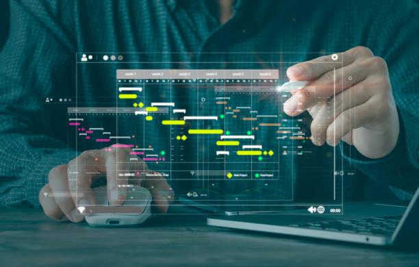 istock Project manager updating Gantt chart planning on a virtual screen and milestones progress planning with scheduling interface for company, Business Project Management System. 1430370589