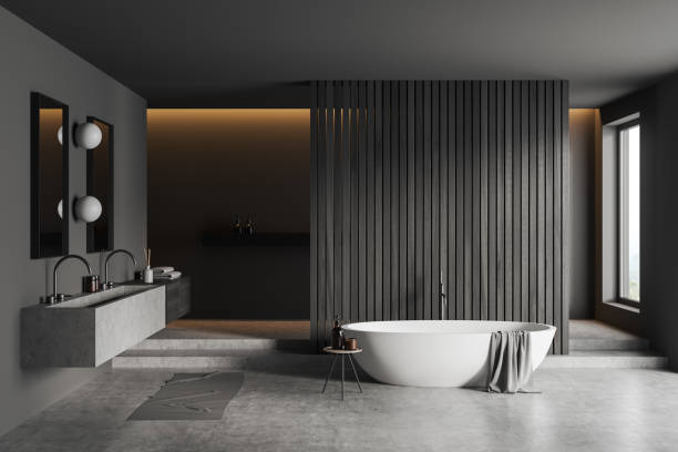 istock Front view on dark bathroom interior with bathtub, two mirrors 1430372153