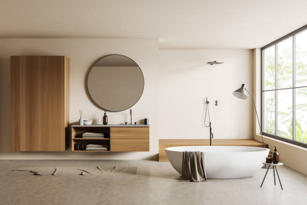 istock Light bathroom interior with sink and douche, bathtub and panoramic window 1430372318