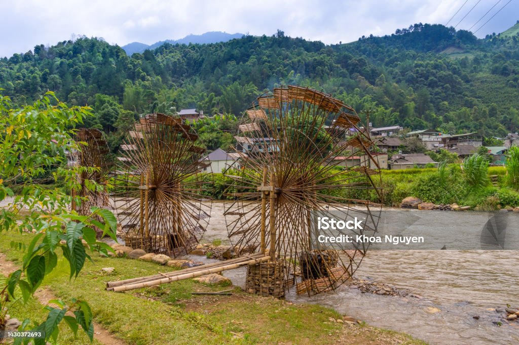 view of Water mill in Mu Cang Chai, Yen Bai province, Vietnam in a summer day view of Water mill in Mu Cang Chai, Yen Bai province, Vietnam in a summer day. Travel and landscape concept. Water Wheel Stock Photo