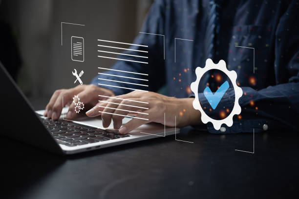 istock Businessman using laptop computer with quality assurance and document icon for ISO management strategy marketing technology concept. 1430373306