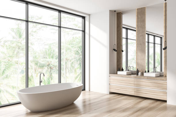 istock Light bathroom interior with double sink and bathtub, panoramic window 1430373316