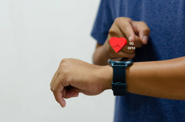 istock man using smart watch with icon heart red health care concept. 1430373321
