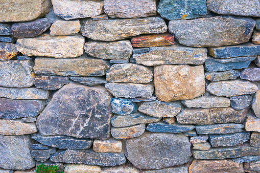 Close up of a dry stone wall, built without mortar in central Massachusetts.