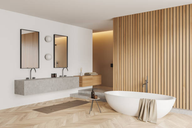istock Light bathroom interior with sink and tub, accessories on deck. Empty wall 1430375428