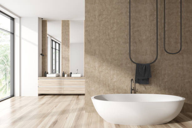 istock Front view on bright bathroom interior with two mirrors, bathtub 1430375711