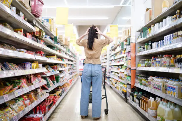 Photo of Woman worried at the grocery store