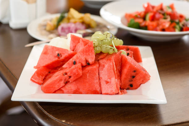 istock Watermelon and grapes on a dessert plate. 1430382450