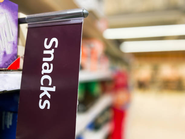 istock Snacks sign close up in supermarket aisle 1430384005