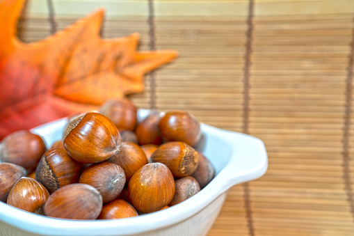 Hazelnut in white bowl for background