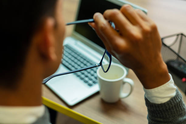 istock hands of young man working in his office through his electronic devices 1430386292